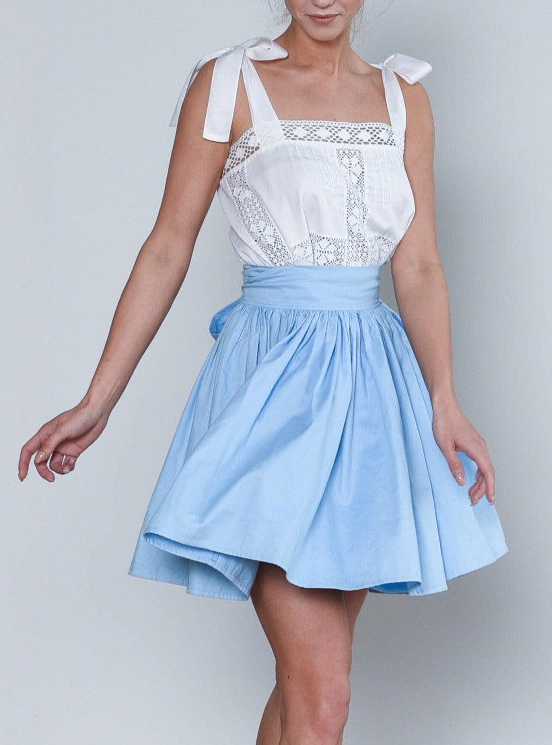 Alice in Wonderland Full Cricle Wrap Mini Skirt in Sky Blue Madde Vintage Timeless Pieces Curated for You Alice in Wonderland Full Cricle Wrap Mini Skirt in Sky Blue Madde Vintage Timeless Pieces Curated for You